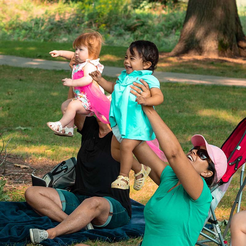 image of mom's and their babies playing at baby rock in the park
