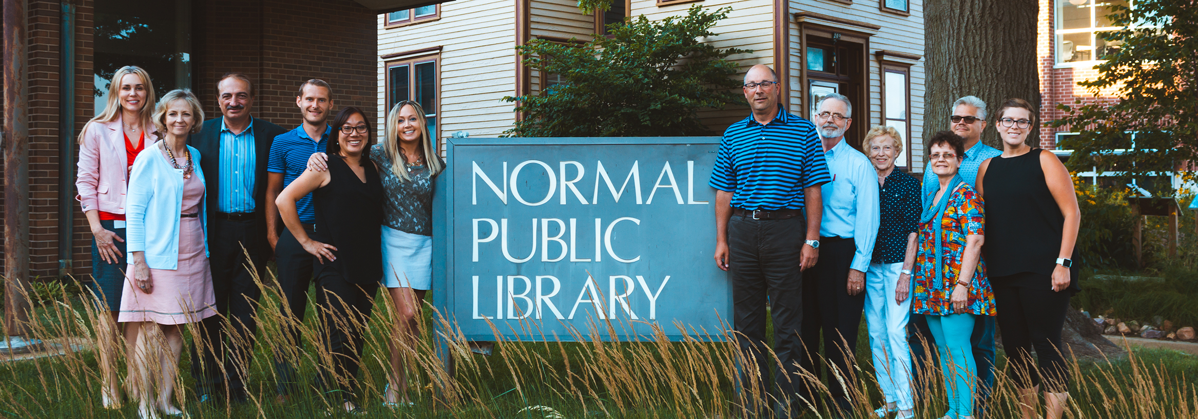image of the Normal Public Library Foundation Board in front of the library's sign