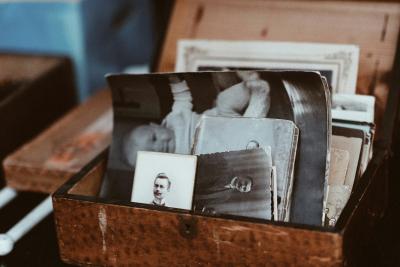 Photo of vintage pictures in a wooden box by Roman Kraft on Unsplash