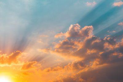 Photo of rising sun and clouds by DiegoPH from Unsplash